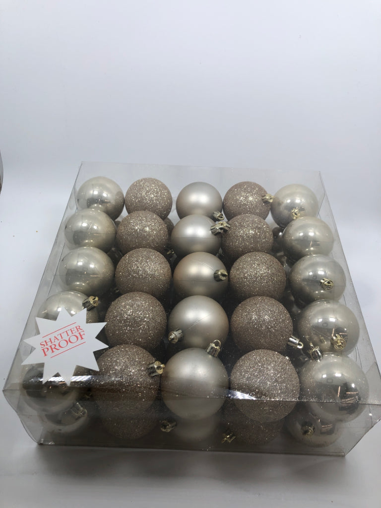 NIP 50PC ROSE GOLD ORNAMENTS.