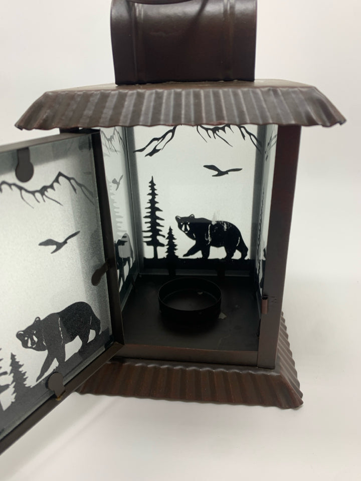 BROWN METAL LANTERN W/BEAR FOREST GLASS.
