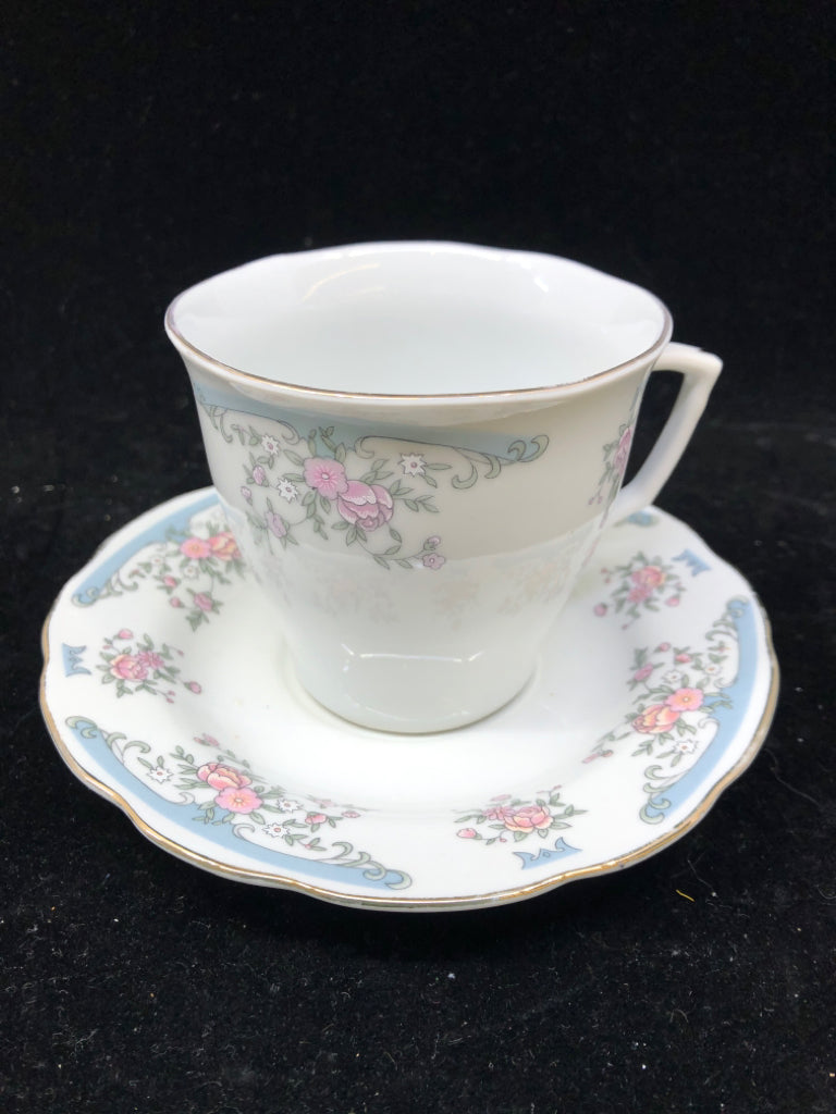 PALE BLUE W PINK FLORAL TEACUP AND SAUCER.