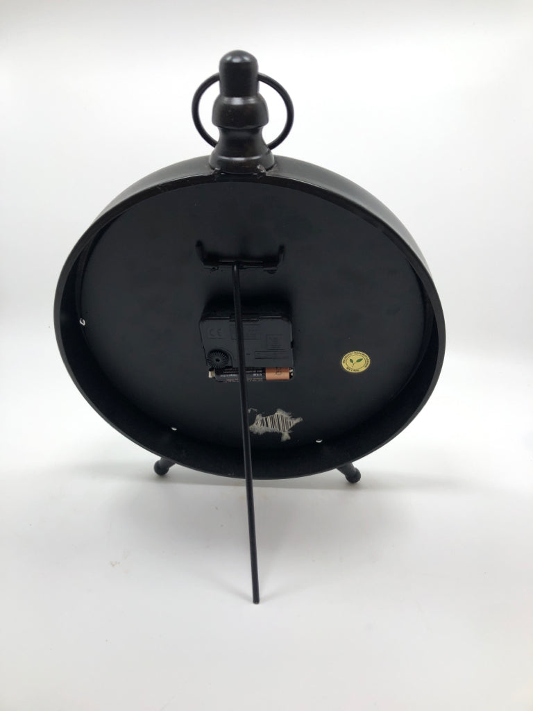 SM DISTRESSED STANDING METAL CLOCK.