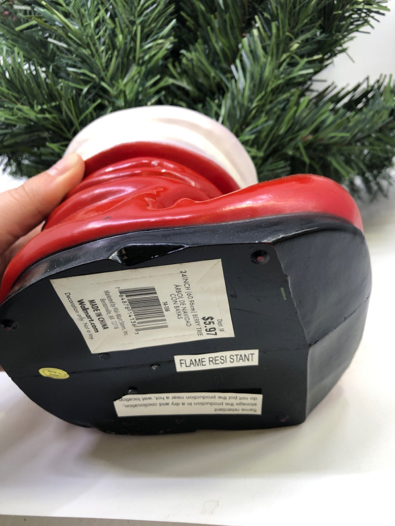 MINI HOLLY TREE IN SANTAS BOOT.