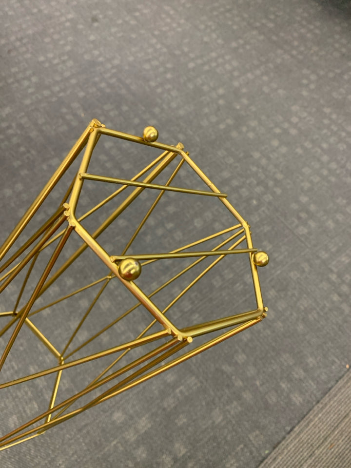 GOLD HEXAGON TOILET PAPER HOLDER.