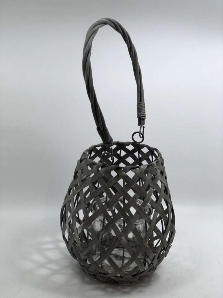 GRAY WOVEN CANDLE LANTERN.