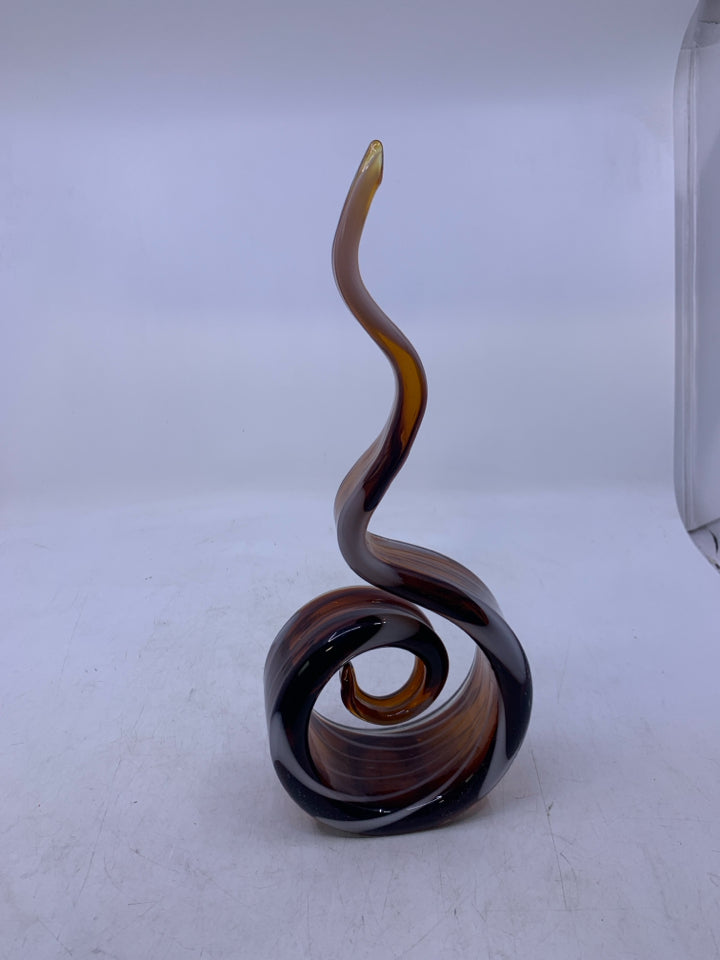 BROWN BLOWN GLASS SWIRL STANDING ABSTRACT PIECE W/ WHITE LINES.