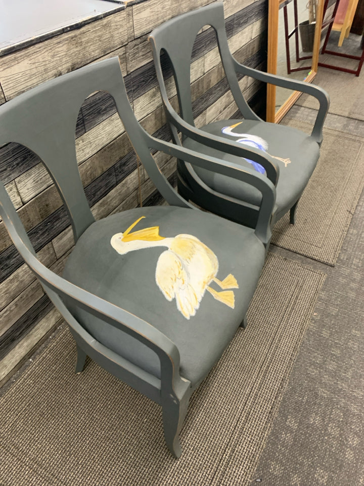 2 REFURBISHED DARK GREY ACCENT CHAIRS W/ PAINTED SEA BIRDS ON SEAT.