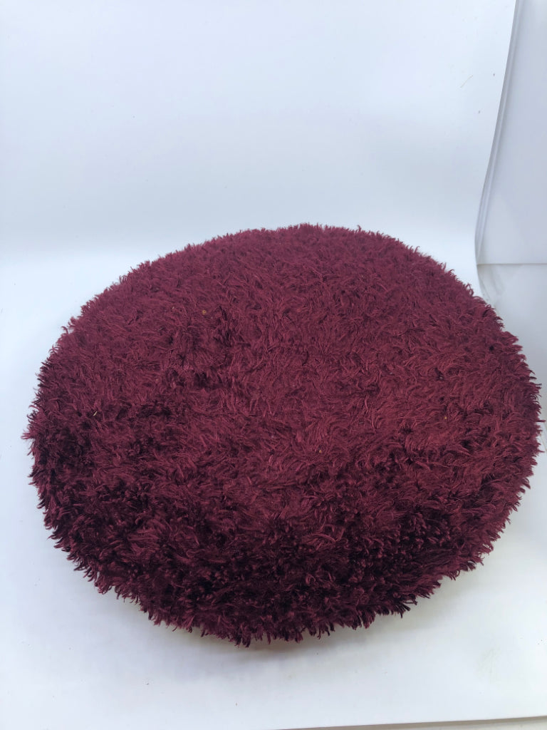 ROUND MAROON PILLOW.