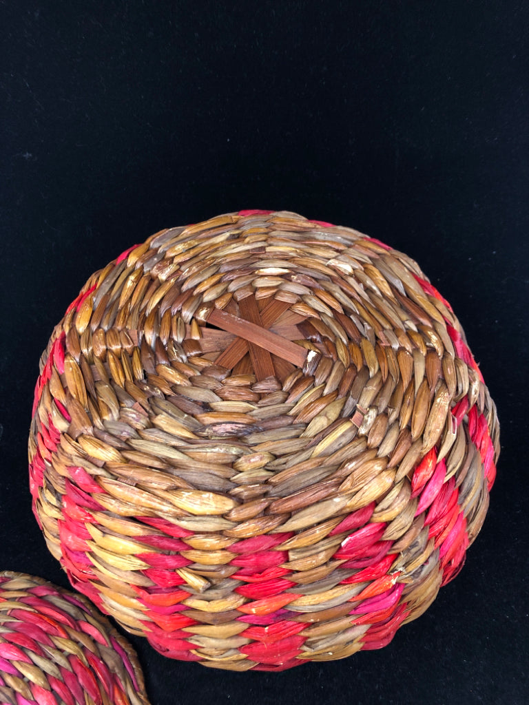 MULTI COLORED WOVEN COVERED BASKET.