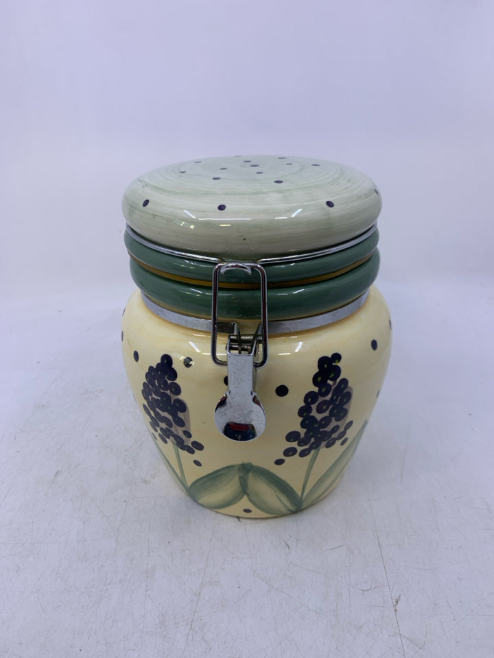 CERAMIC CANISTER W/ PURPLE FLOWERS GREEN POLKA DOT LID.