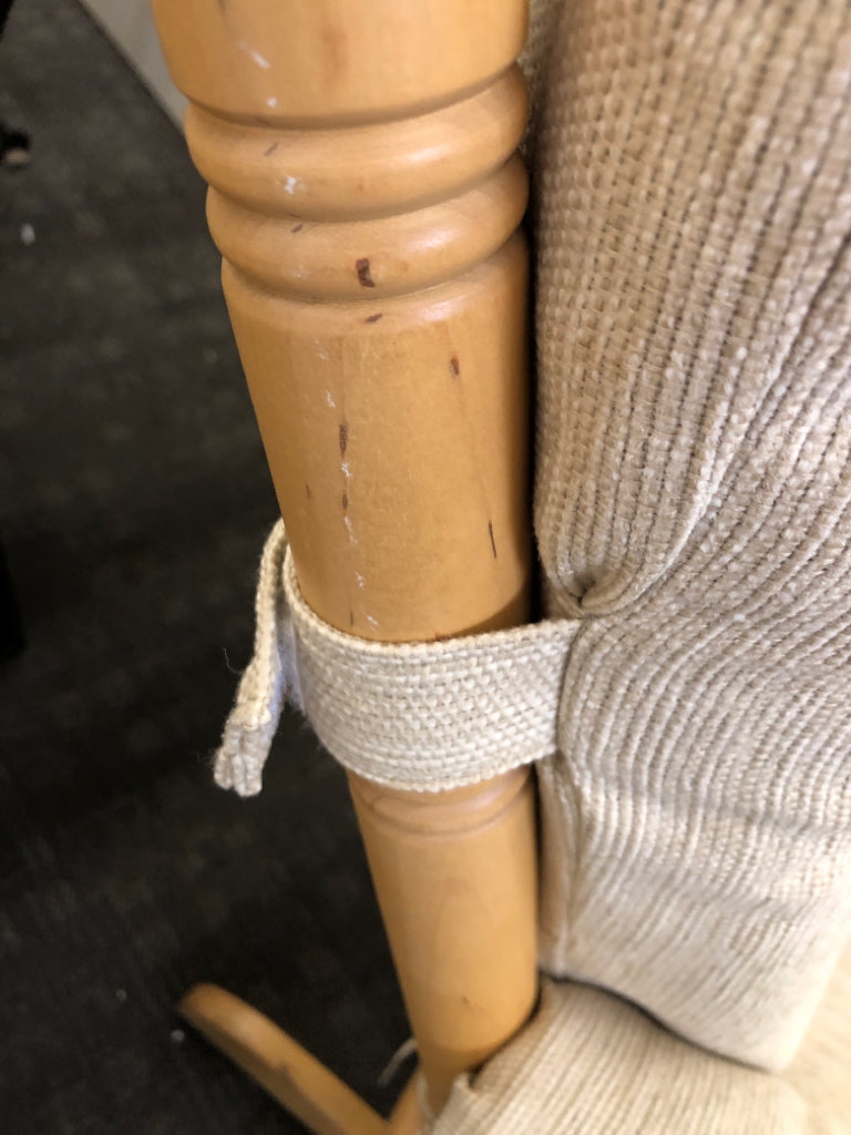 BLONDE WOODEN ROCKING CHAIR W/LEVER TO LOCK & BEIGE CUSHION.