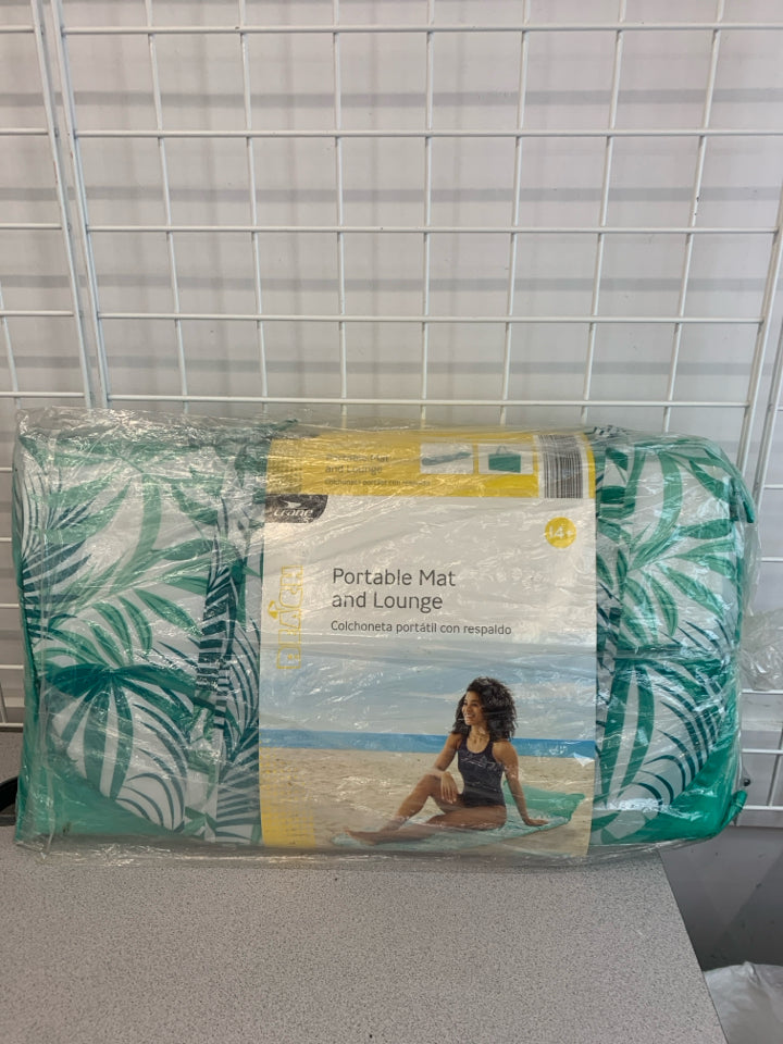 NIP PORTABLE BEACH MAT AND LOUNGE.