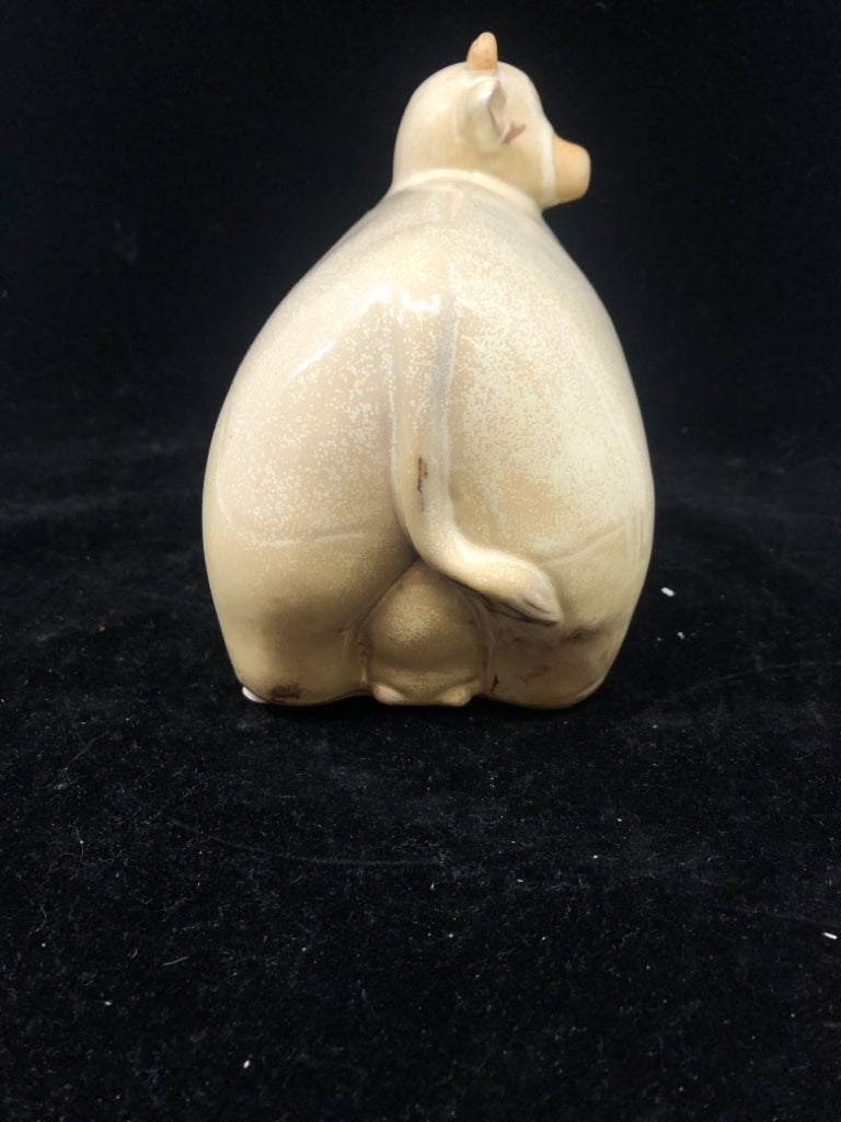 TAN CERAMIC COW.