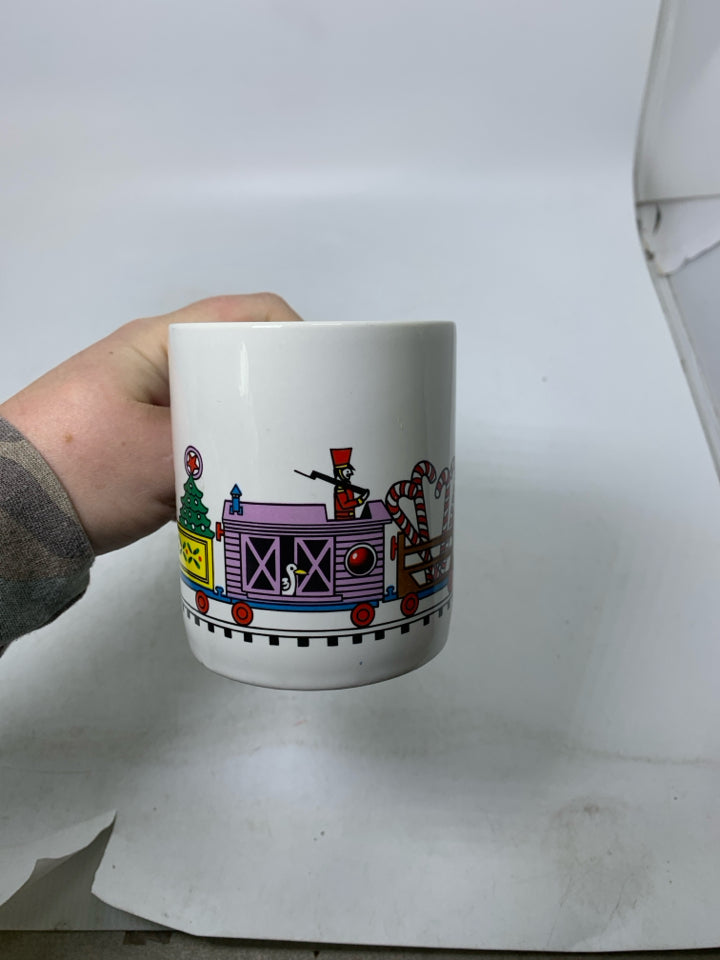 VTG WHITE MUG W/ CANDY CANE HANDLE TRAIN AROUND.