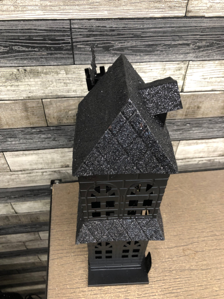 BLACK METAL AND GLITTER LED HAUNTED HOUSE.