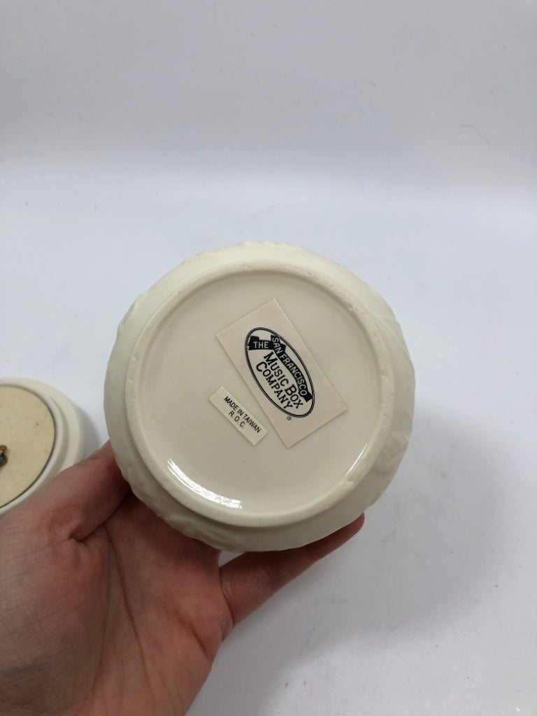 CIRCLE CERAMIC EMBOSSED ROSES MUSIC BOX.