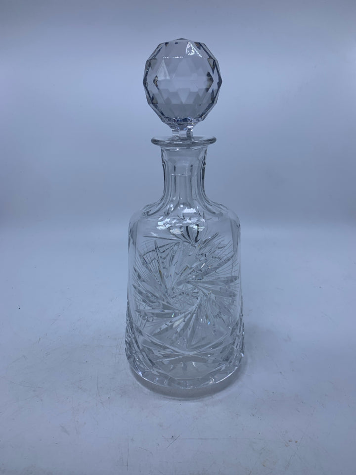 CRYSTAL DECANTER STAR DETAILS AND LARGE BALL STOPPER.