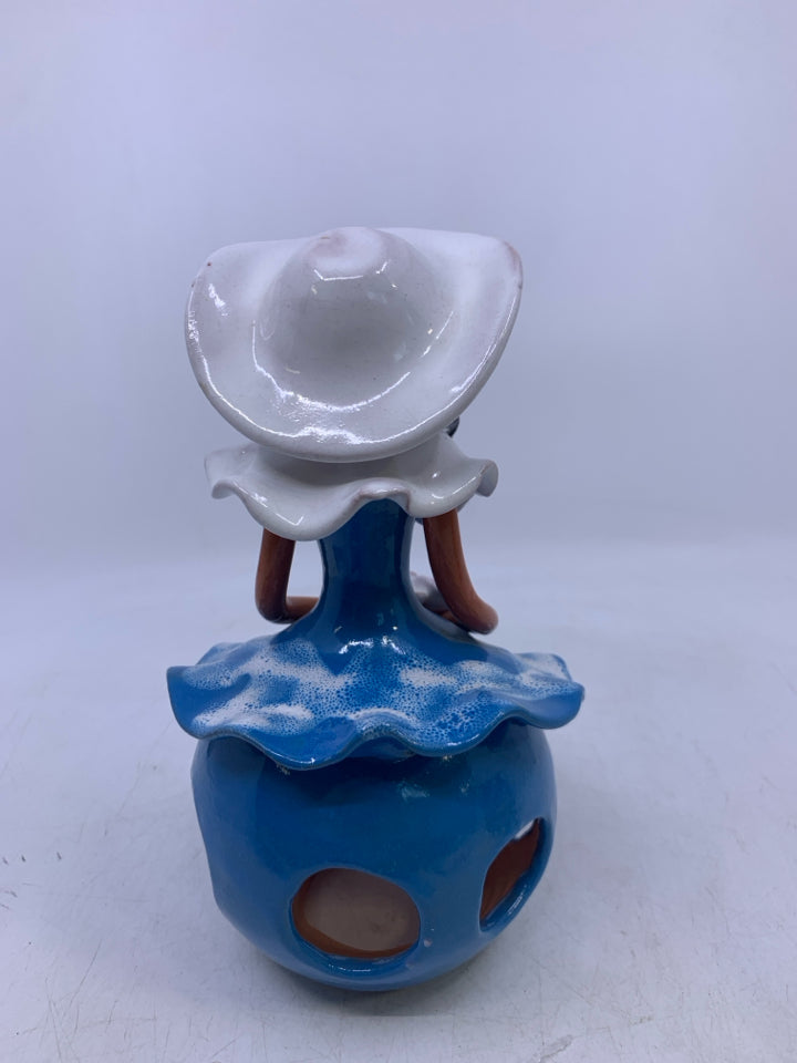 CLAY FACELESS WOMAN W/ BLUE DRESS W/ HOLES + WHITE HAT.