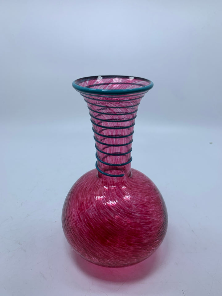 PINK SPECKLED BLOWN GLASS VASE W/ EMBOSSED BLUE SWIRL ON NECK.