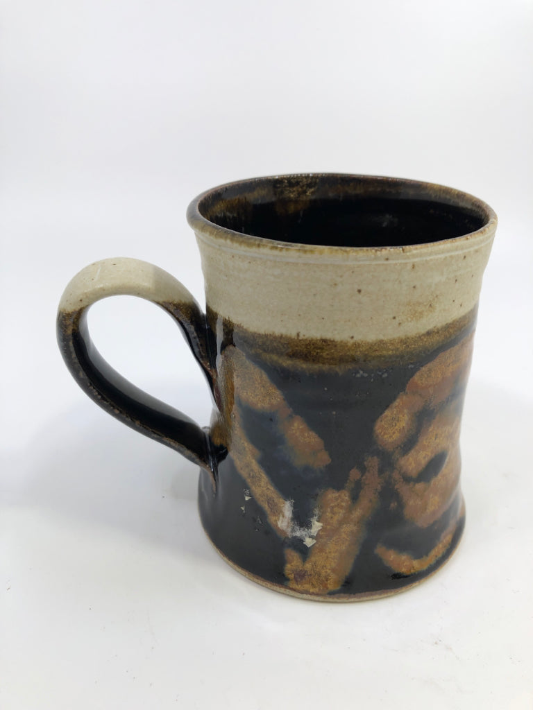 CREAM POTTERY MUG W/ BROWN&BLACK DESIGN.