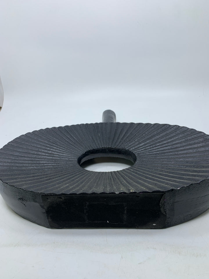 LARGE BLACK RIBBED METAL DONUT HOLE VASE.