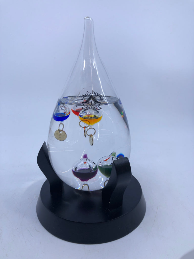 GLASS TEMPERATURE GAGE IN BLACK STAND.