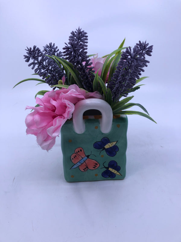 FAUX PINK AND PURPLE FLORAL IN CERAMIC GREEN BUTTERFLY BAG.