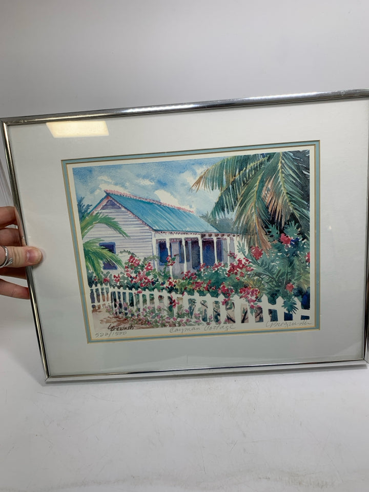 COTTAGE SCENE W/ RED FLOWERS FENCE WATERCOLOR SIGNED BY ARTIST SILVER FRAME.