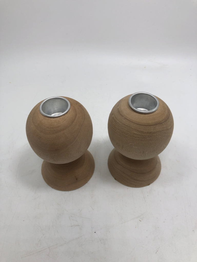 2 SM WOOD CARVED CANDLE HOLDERS.
