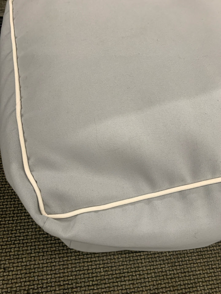GREY CUBE OTTOMAN W WHITE ACCENT.