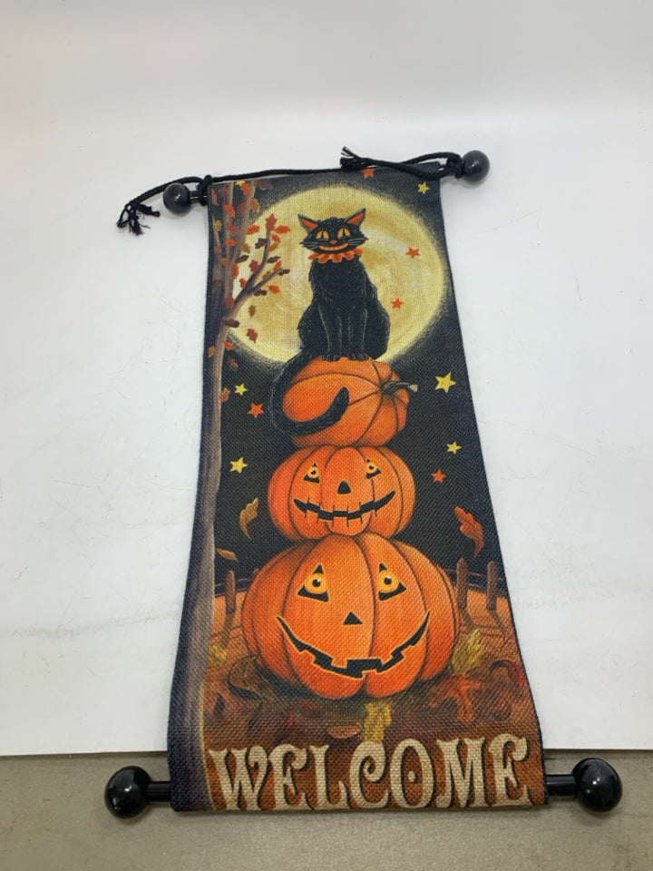 HANGING WELCOME BLACK CAT ON STACKED JACKO LANTERNS FABRIC SIGN.