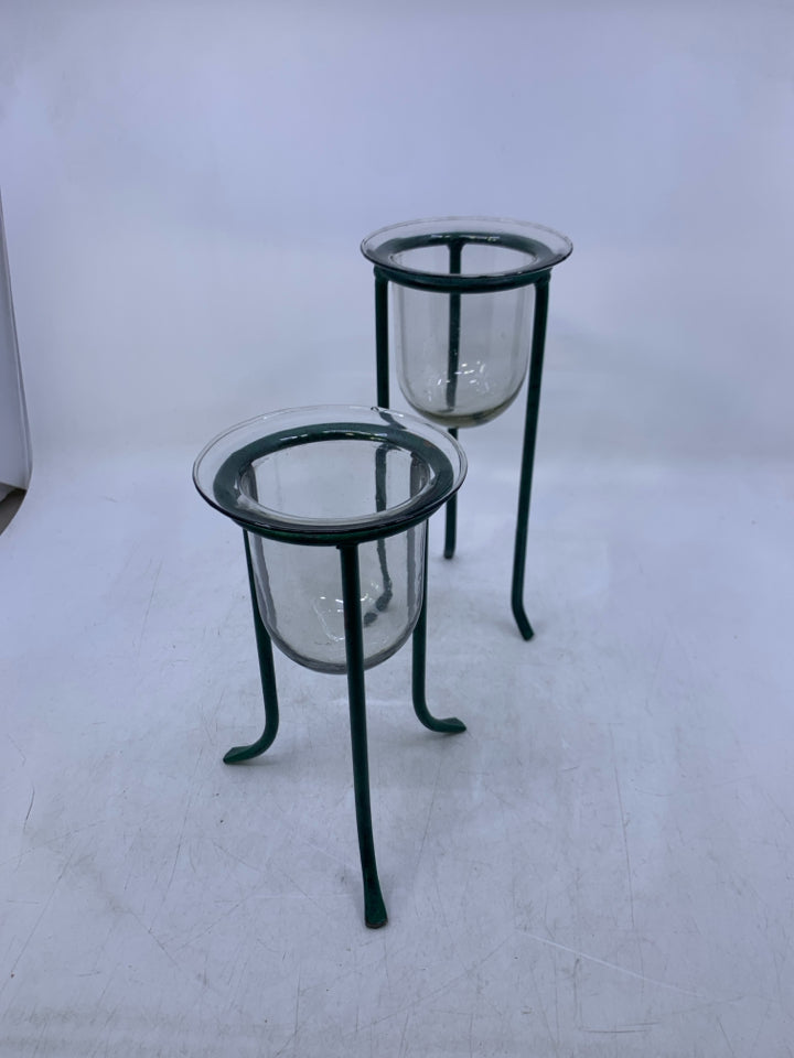 2 GREEN METAL STANDS W/ GLASS INSERTS.