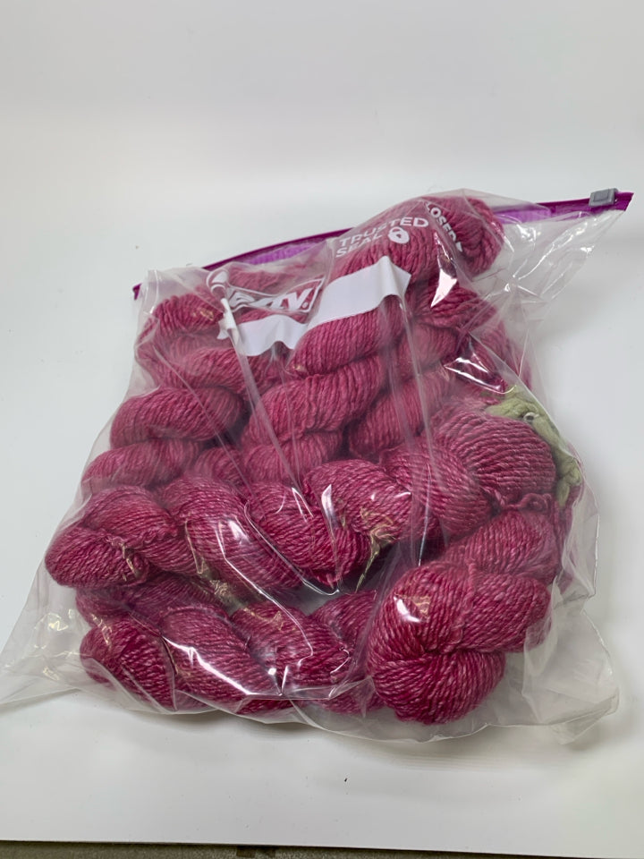 LARGE BAG OF PINK WOOL YARN.
