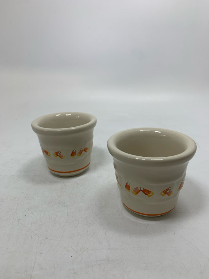 2 CANDY CORN VOTIVES POTTERY HOLDERS.