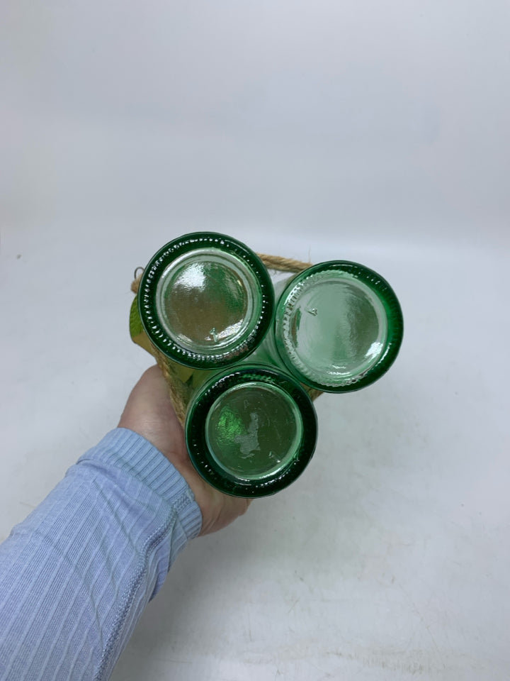3 GREEN BOTTLE WRAPPED TOGETHER W/ CORK TOPS.