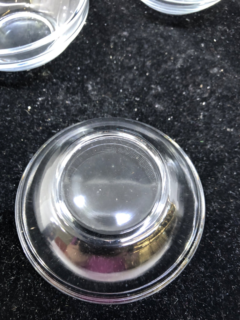 4 SMALL CLEAR SPICE JARS.