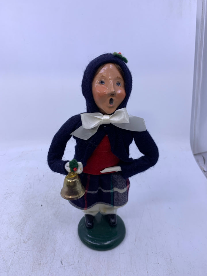GIRL CAROLER W/ DARK BLUE COAT HOLDING BELL 1988 BYERS' CHOICE.