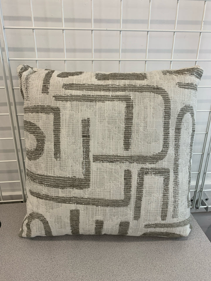 WHITE PILLOW W/ GREY GEOMETRIC DESIGN.