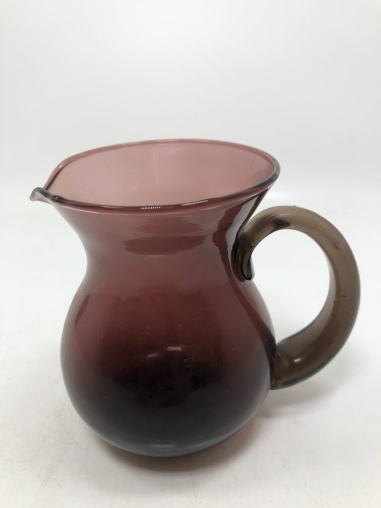 SMALL PURPLE GLASS PITCHER.