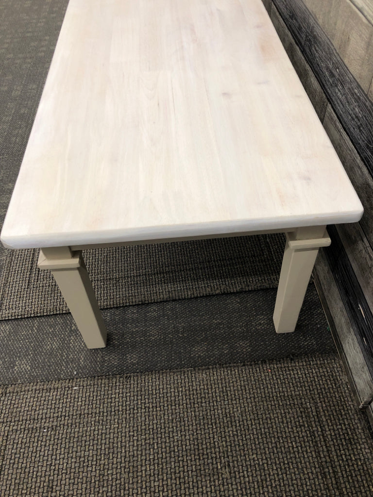 DISTRESSED WHITE TOP CREAM LEGS COFFEE TABLE.