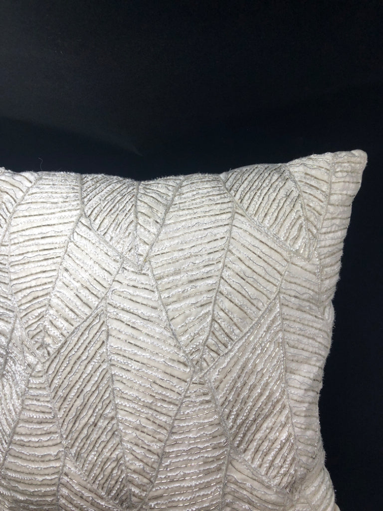BEADED WHITE PILLOW.