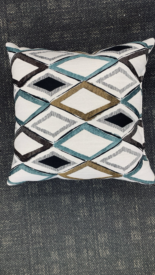WHITE ACCENT PILLOW TEAL/BROWN/BLACK TRIANGLE DESIGN.