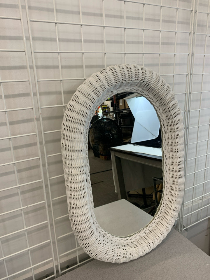 OVAL WHITE WICKER HANGING MIRROR.