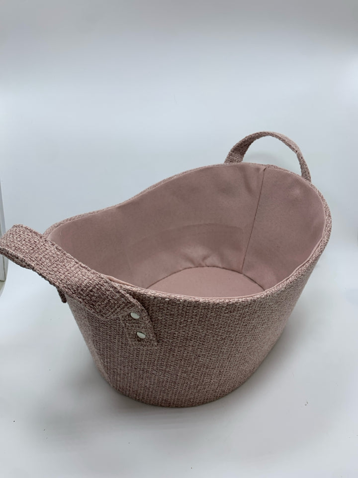 PINK FABRIC OVAL STORAGE BIN W/HANDLES.