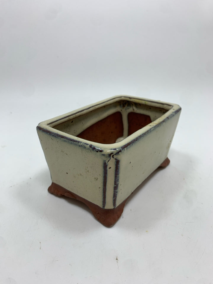 TAN GLAZED TERRACOTTA PLANTER.