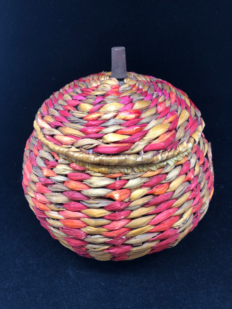 MULTI COLORED WOVEN COVERED BASKET.