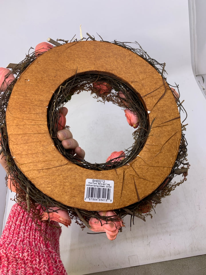 REAL DRIED FLOWERS STICK WREATH W/ PAPER ROLLED PINK FLOWERS.