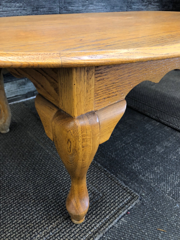 OAK WOOD OVAL COFFEE TABLE .