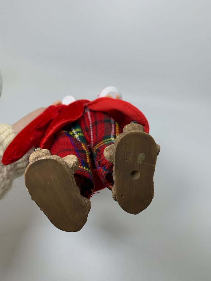 STANDING SANTA IN PJS HOLDING COCOA & COOKIES.