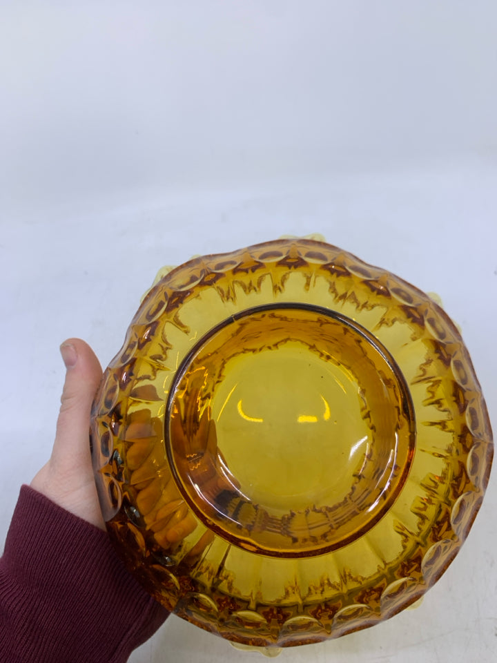 AMBER THUMBPRINT GLASS CANDY DISH W/ RUFFLED EDGE.