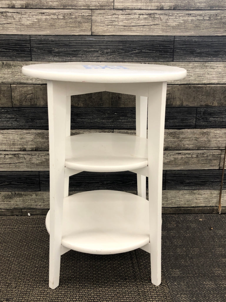 WHITE 3 SHELF ROUND SIDE TABLE W/PAINTED BLUE MEDALLION.
