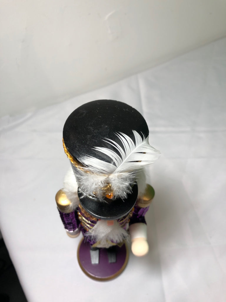 PURPLE SEQUIN NUT CRACKER.